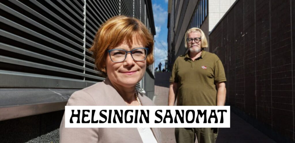 Oikeustieteen professori Anna Nylund (edessä) ja lakitoimisto Takaisinperinnän toimitusjohtaja Olli-Matti Korhonen (takana) seisovat ulkona rakennusten välissä. Nylund hymyilee kameraan, Korhonen katsoo eteenpäin.